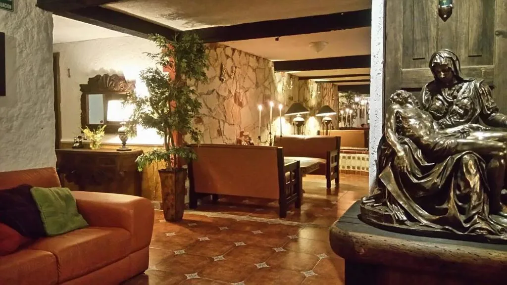 Warm stone and timber lounge at Hotel & Cava La Parroquia